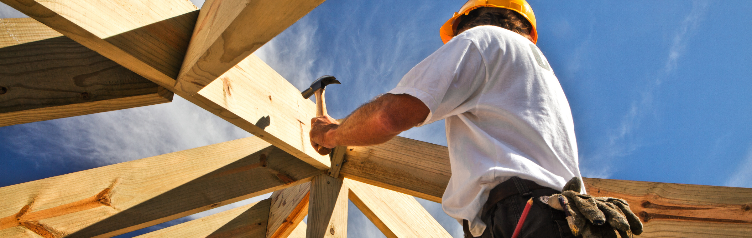 Tips for Working Safely in Different Weather Conditions | Carpenter constructing roof