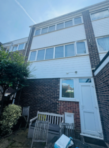 Before image of building with old cladding