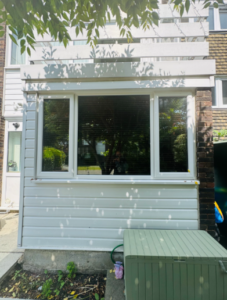 Before image of building with old cladding